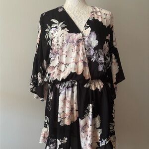 Floral black and cream with hints of pink in the floral pattern shorts Romper